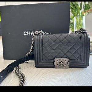 This is an authentic CHANEL Calfskin Quilted Small Boy Flap in Black.